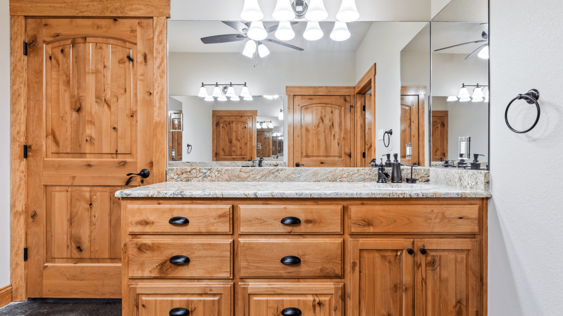 a kitchen with wooden furniture